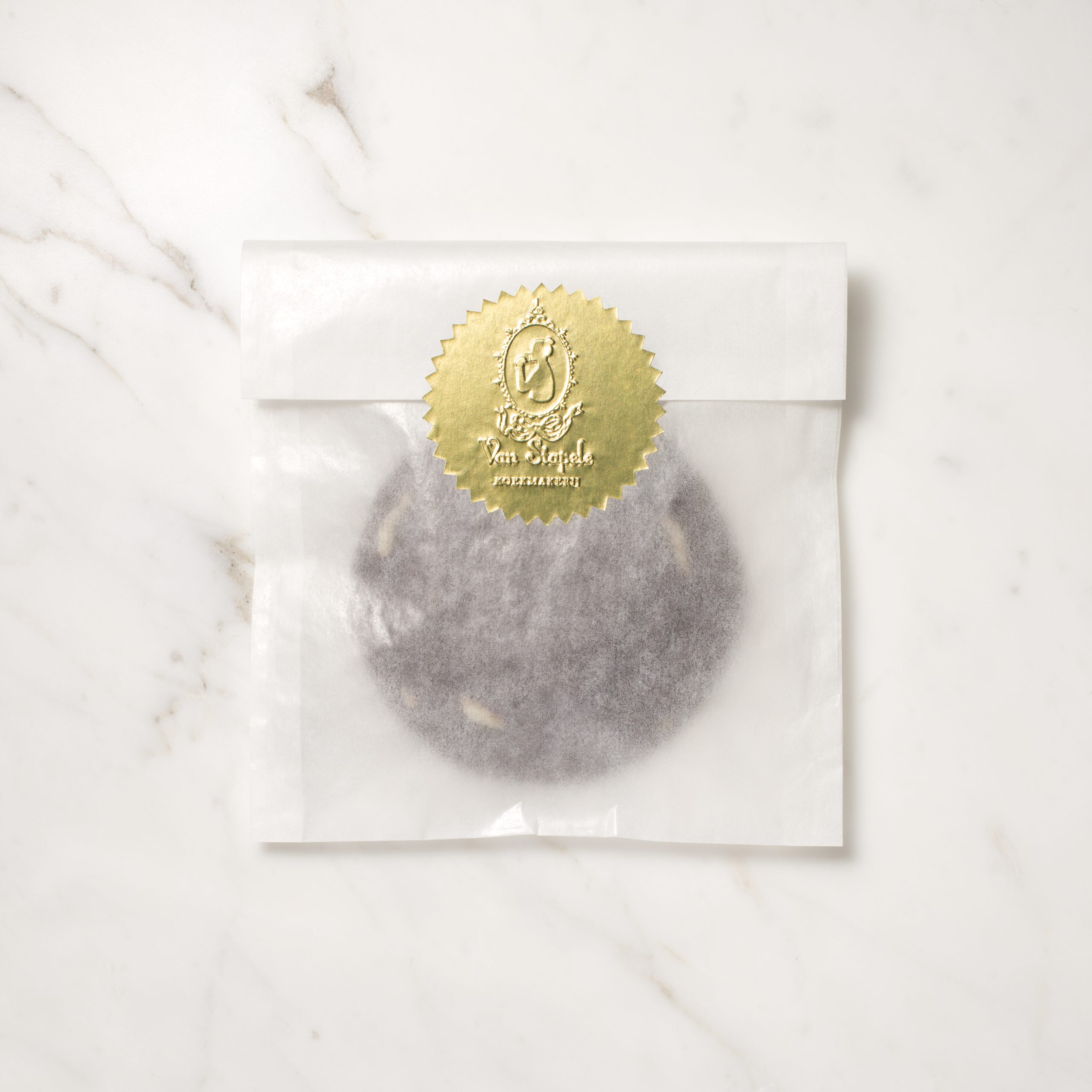 Van Stapele cookie in its paper wrapper